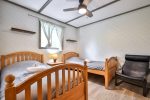 Wood-finished bedroom with double bed