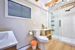 Newly renovated bathroom with walk-in shower and modern fixtures.