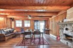 Lakeview Cabin dining table and kitchen with pine beams.