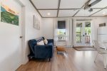 Cozy living room with sofa and bright windows