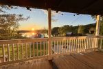Large covered porch overlooking sunset on Lac Heney